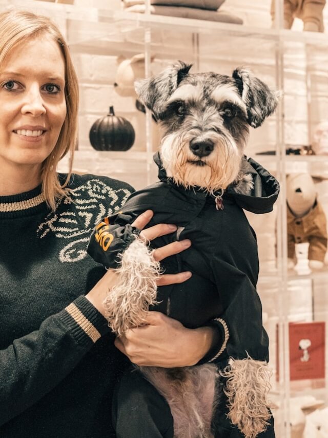 woman holding dog